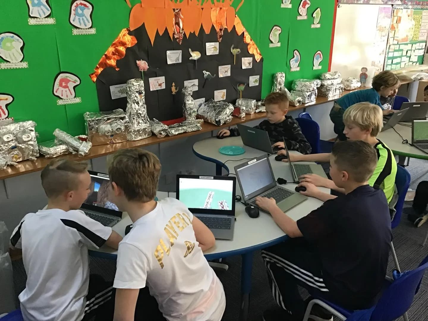 Children building and coding at a Tech Tigers STEM club